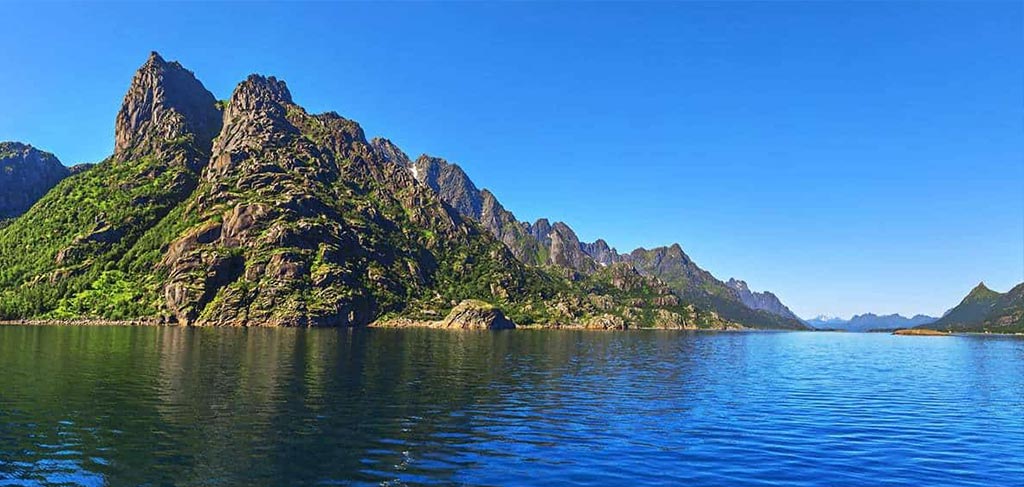 Lofoten Islands Norway solo travel — dramatic fjords and red fishing huts